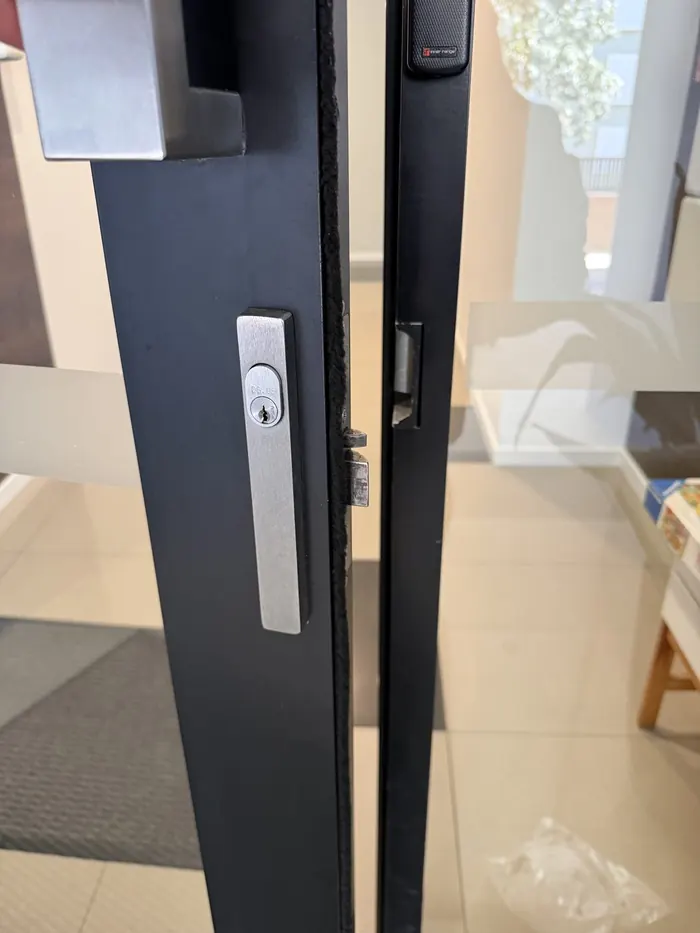 Commercial glass door deadbolt installation